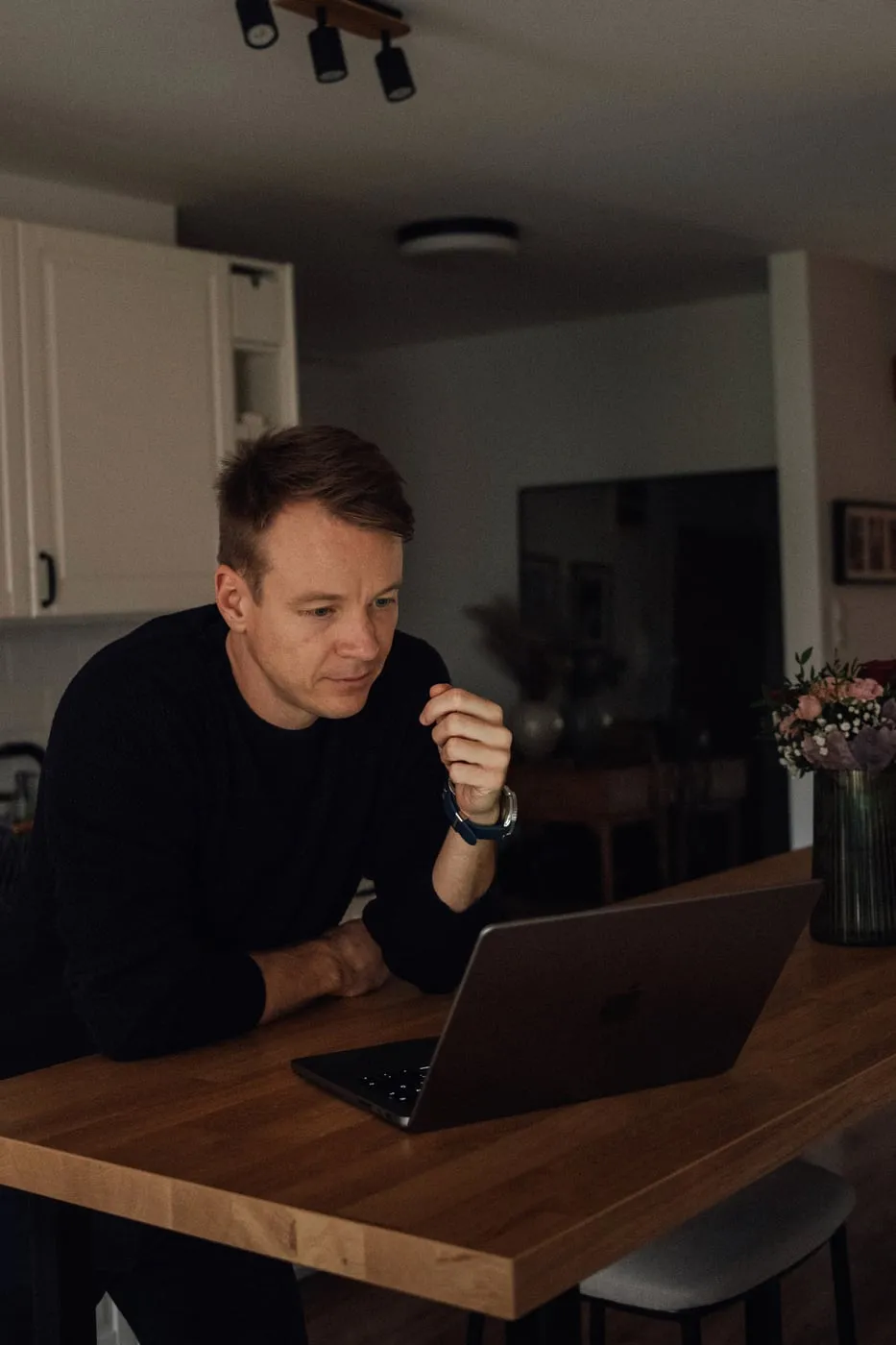 Peter working at a kitchen table