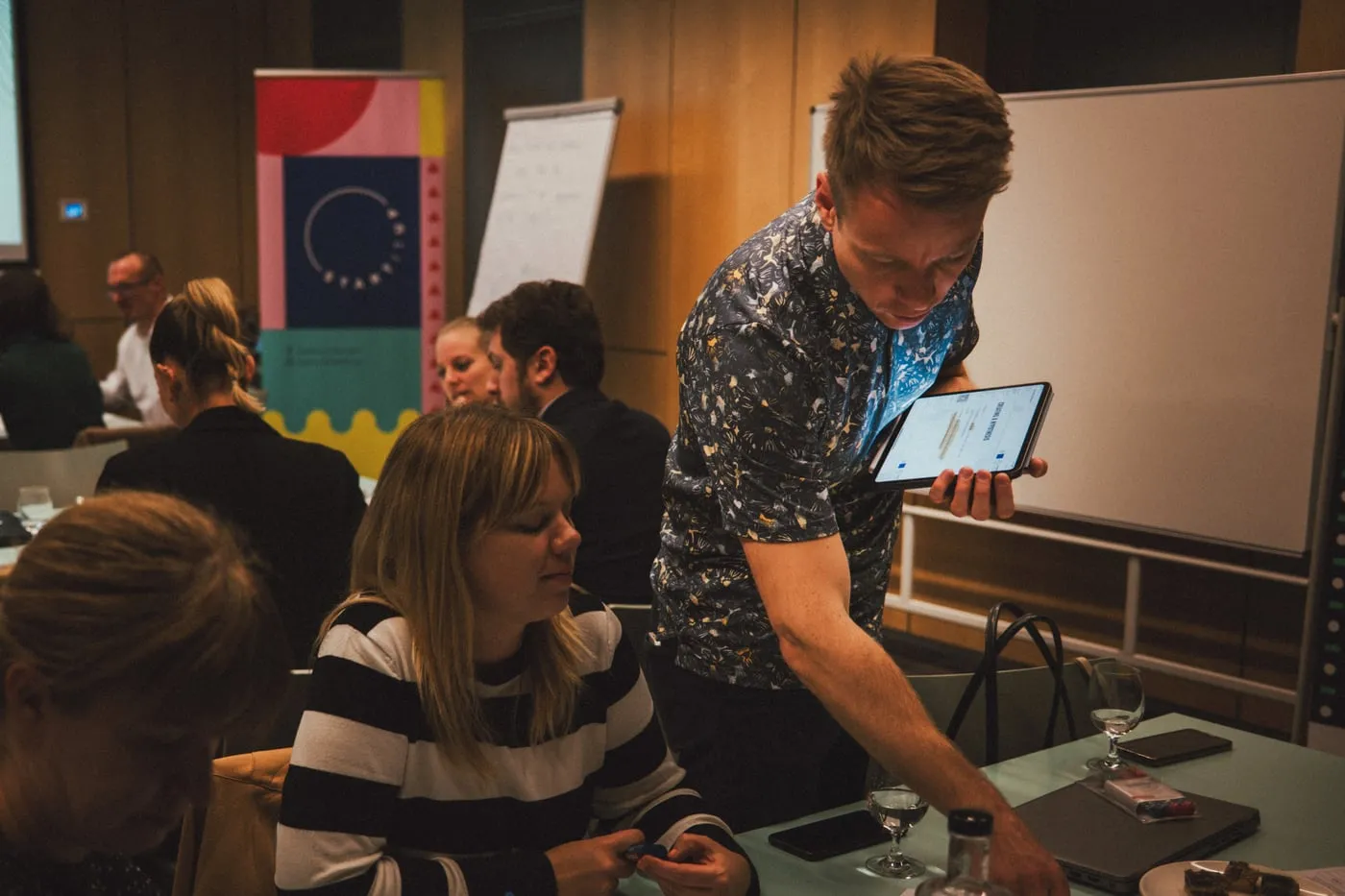 Peter working through an idea with a founder at a workshop table